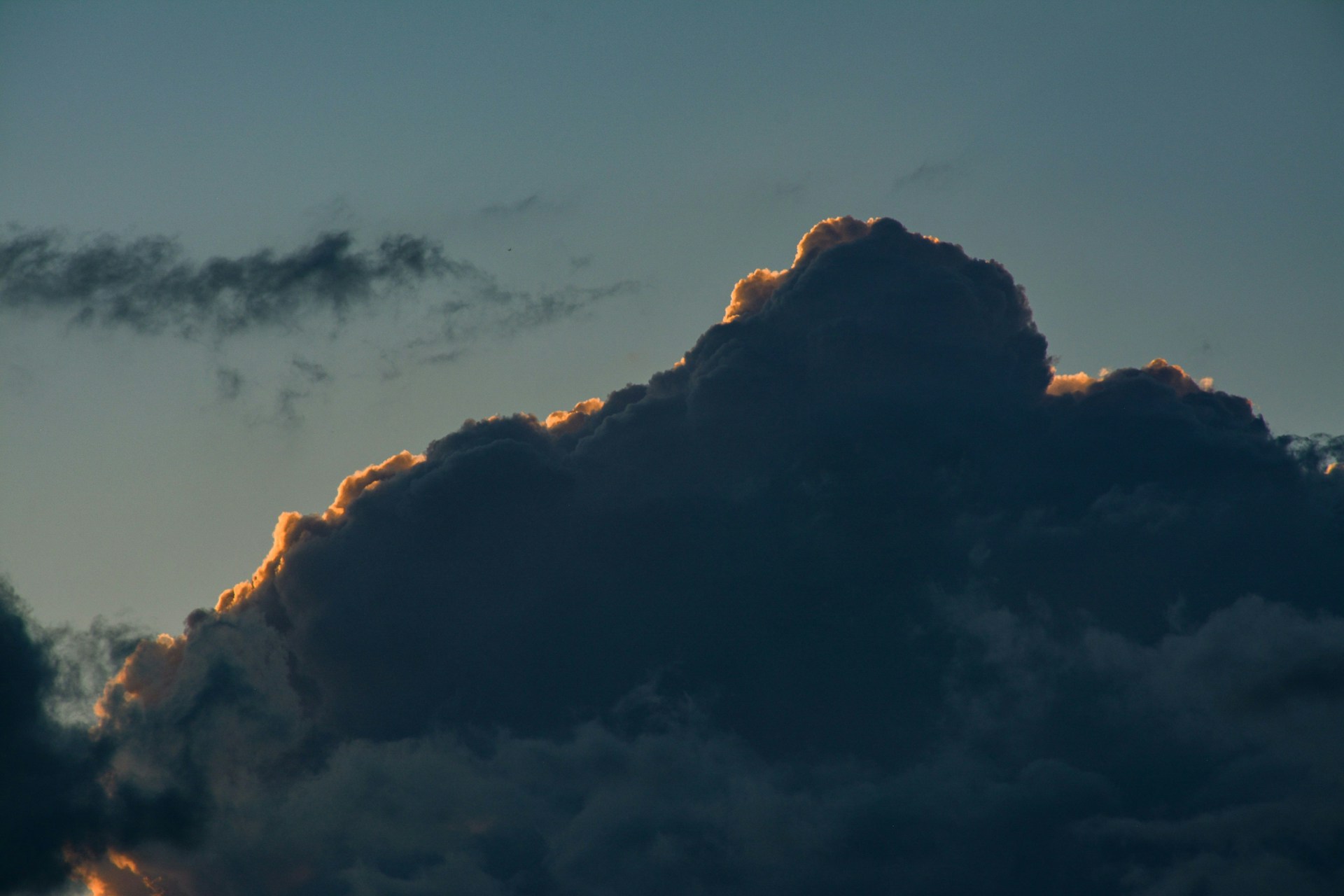a mountain with clouds