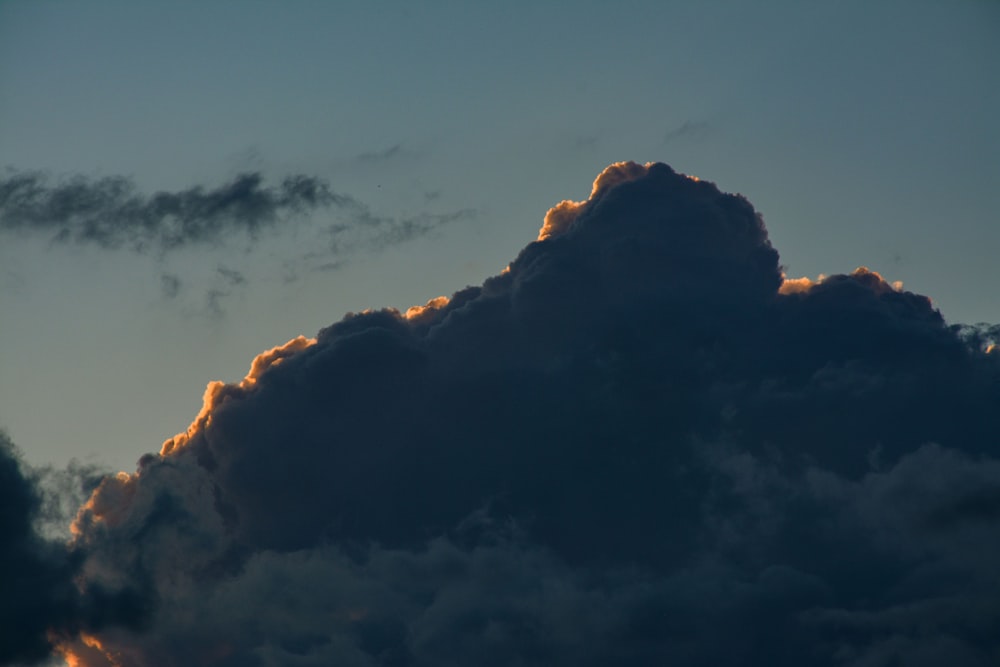 a mountain with clouds