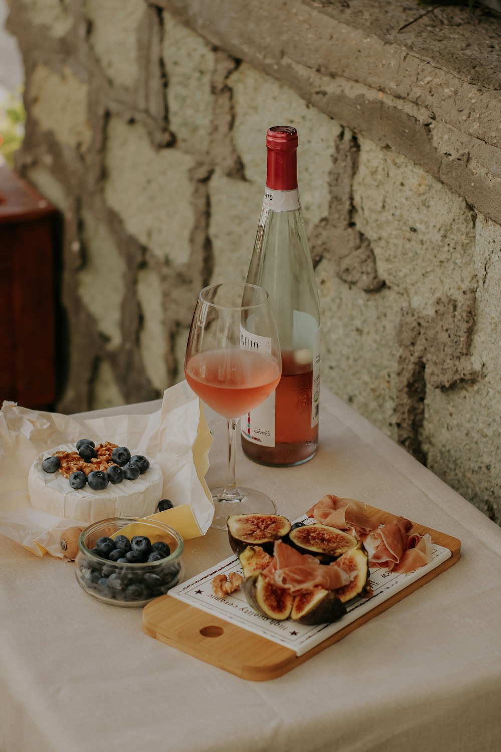 a table with food and a bottle