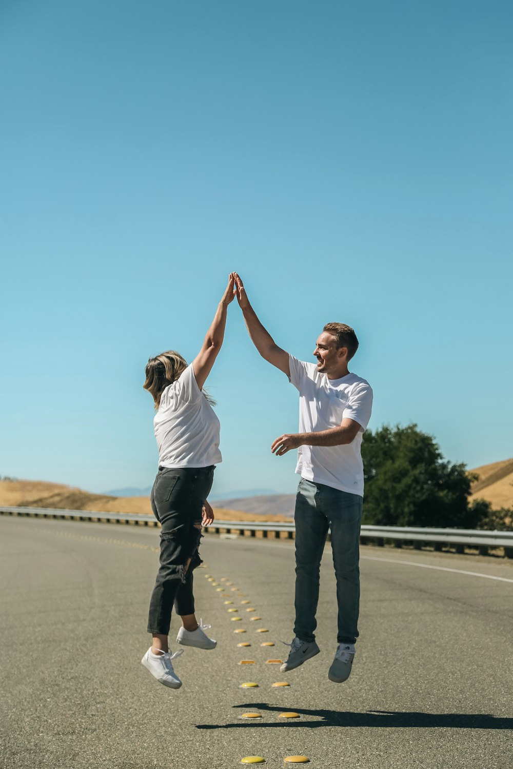 a man and a woman holding hands