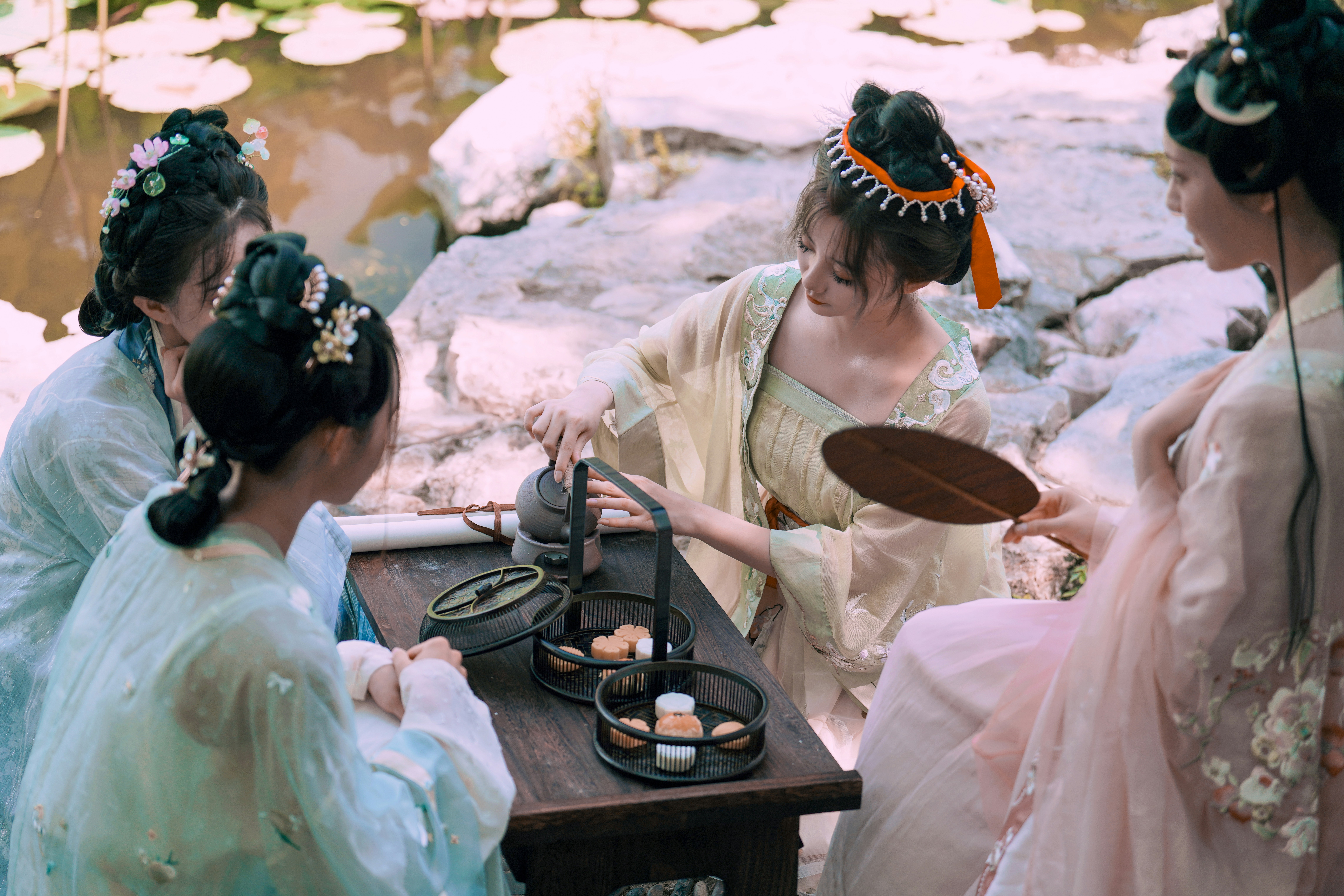 a group of women in white dresses