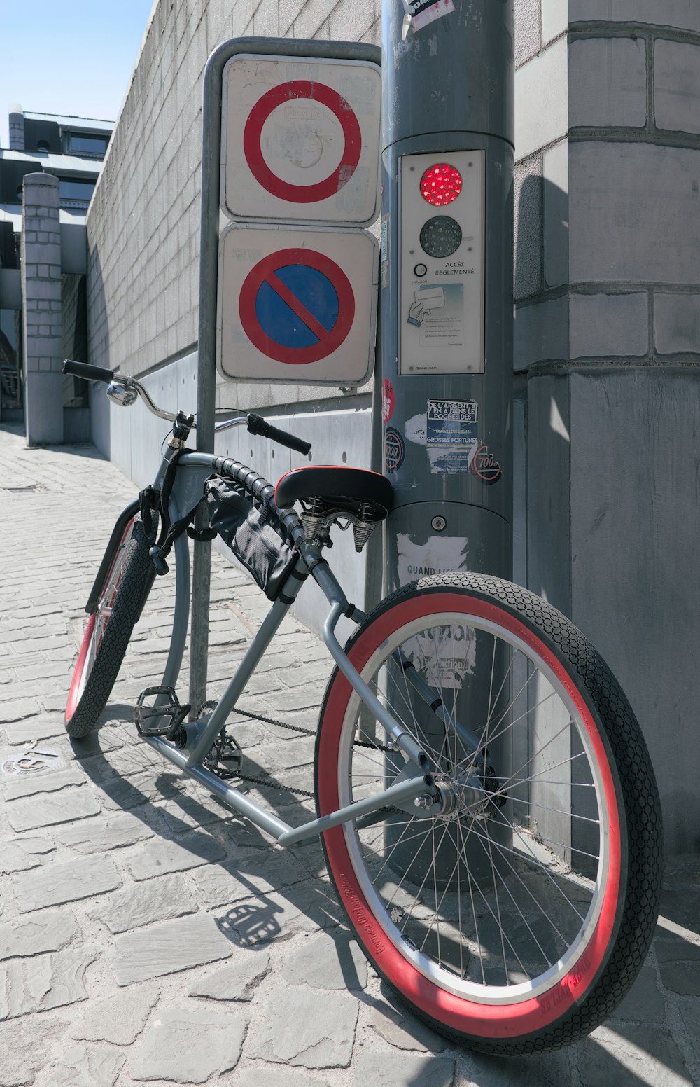 a bicycle is parked next to a parking meter