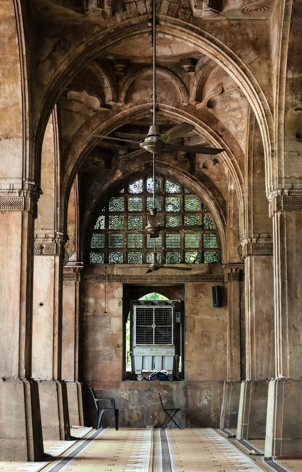 a large arched doorway with a window