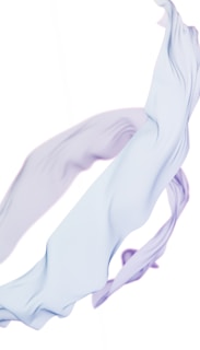 A delicate golden thread weaving through soft, warm white fabric, symbolizing subtle inner transformation.