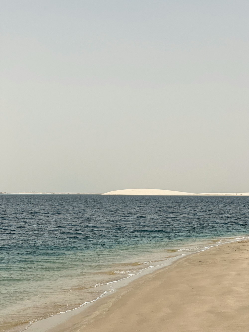 a beach with a body of water