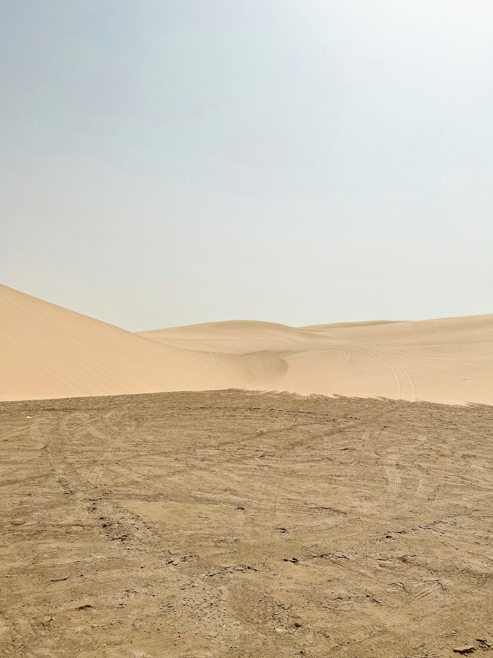 a desert landscape with sand dunes