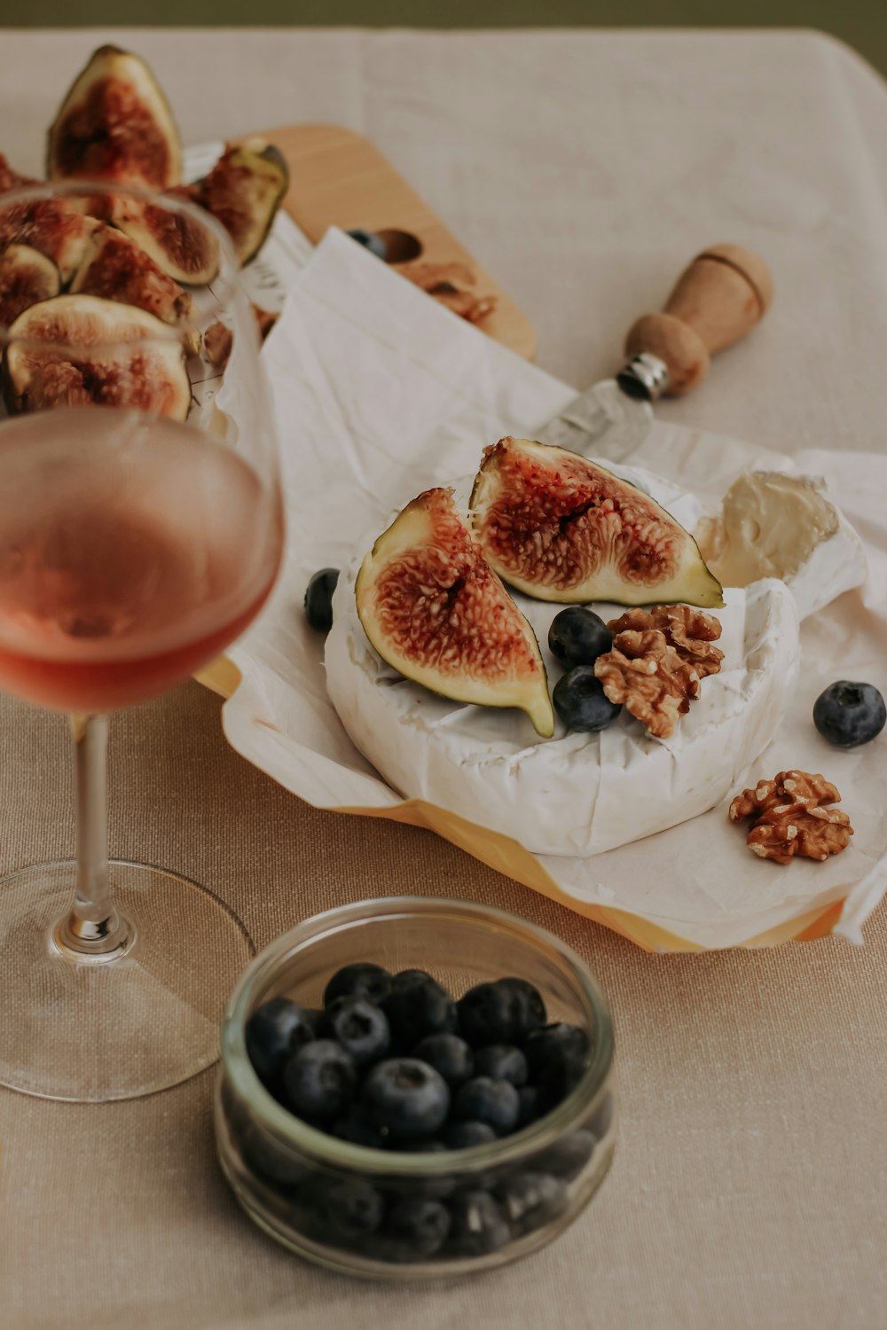 a plate of dessert and a glass of wine