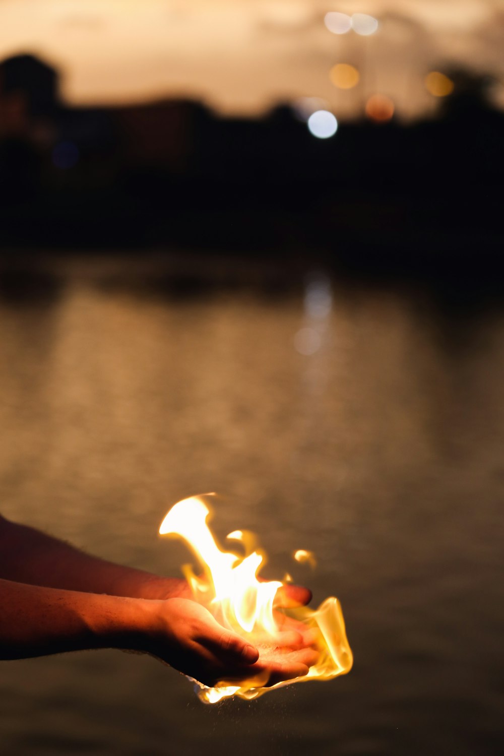 a hand holding a fire