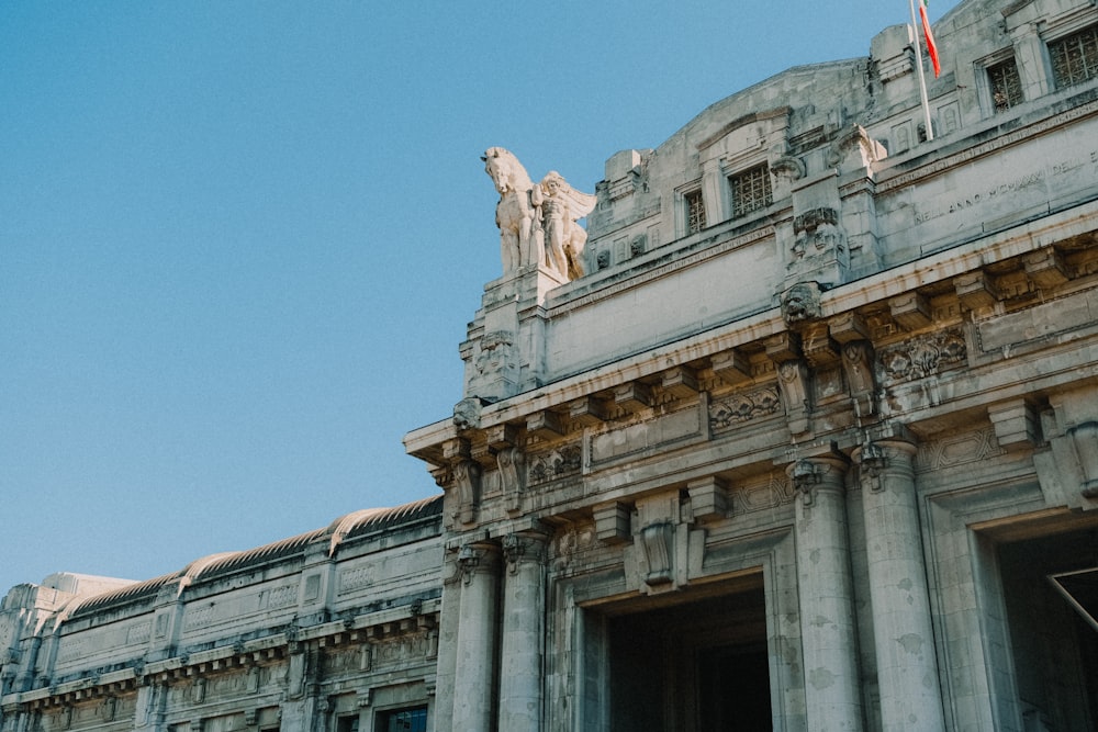 a building with a statue on top