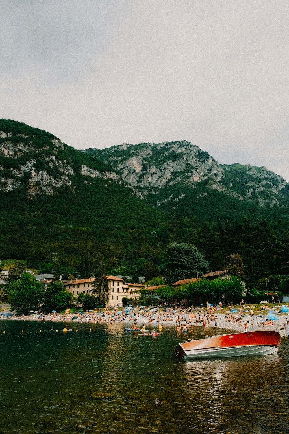 a beach with people and a boat