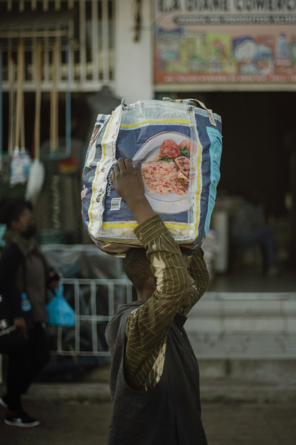 a person carrying a bag of food