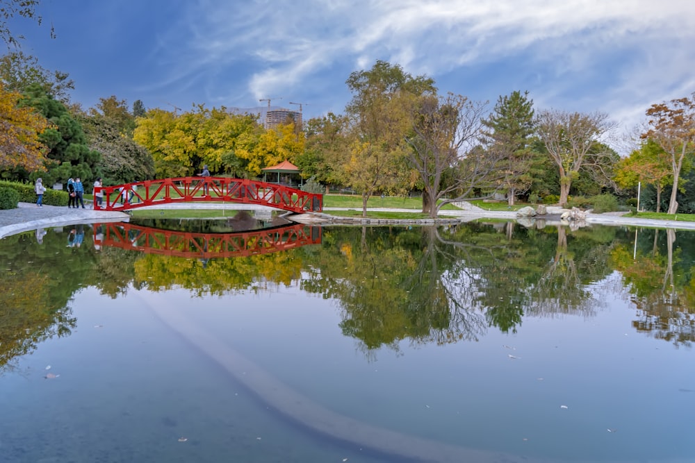 a body of water with a boat in it and trees around it