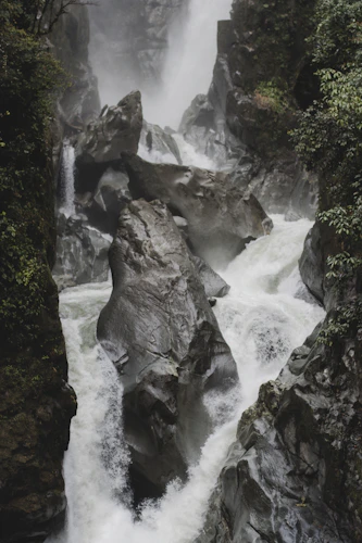 Pailón del Diablo thundering through the rock canyon