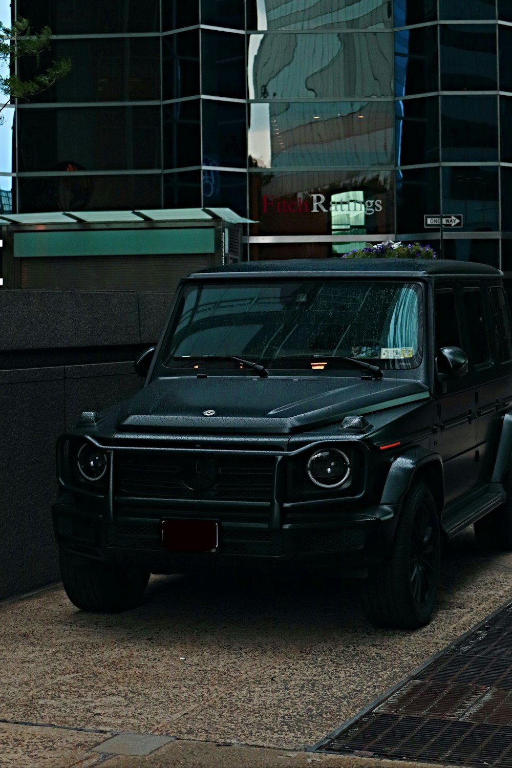 a black car parked in front of a building