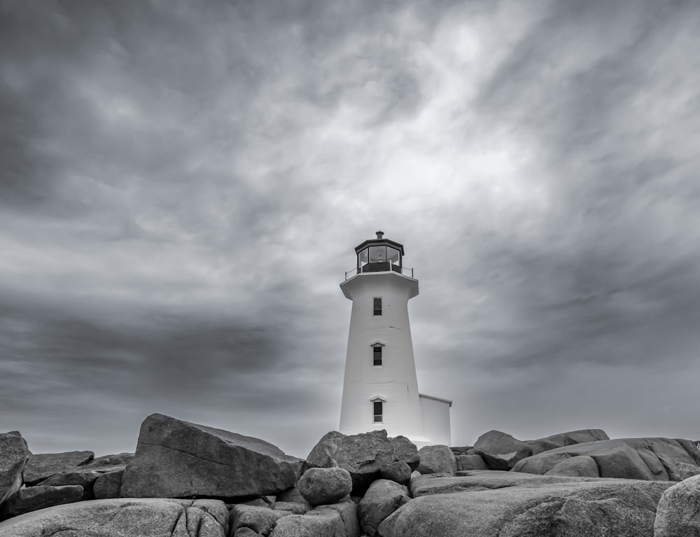 a lighthouse on a rocky hill