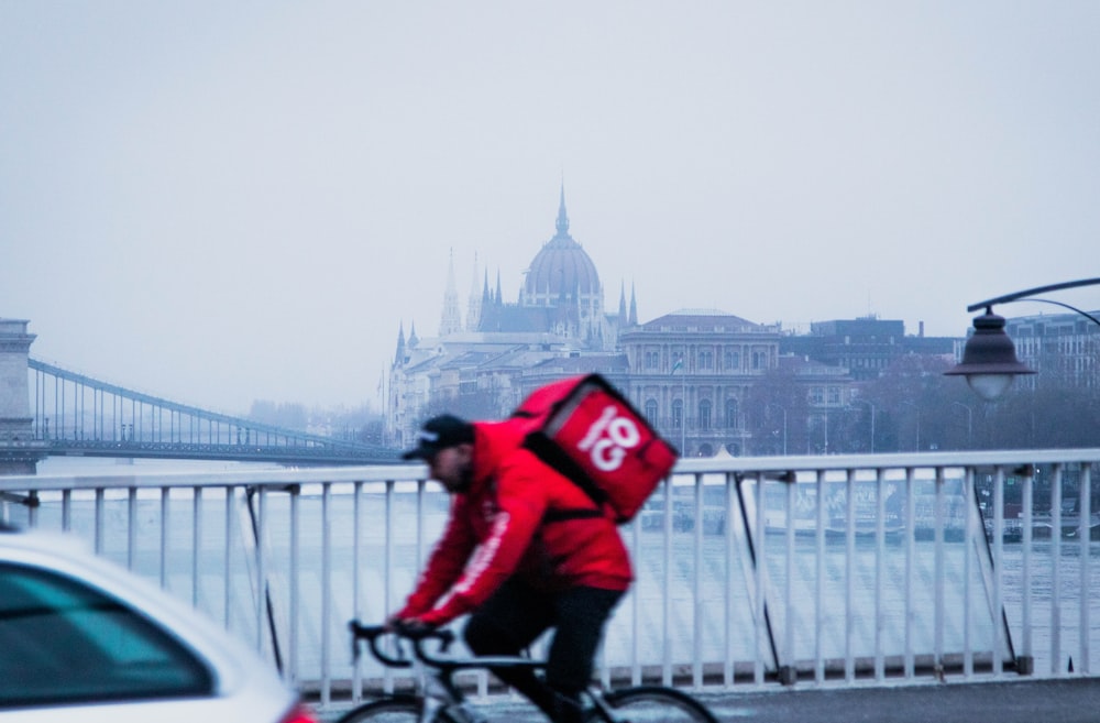 a person riding a bicycle on a bridge