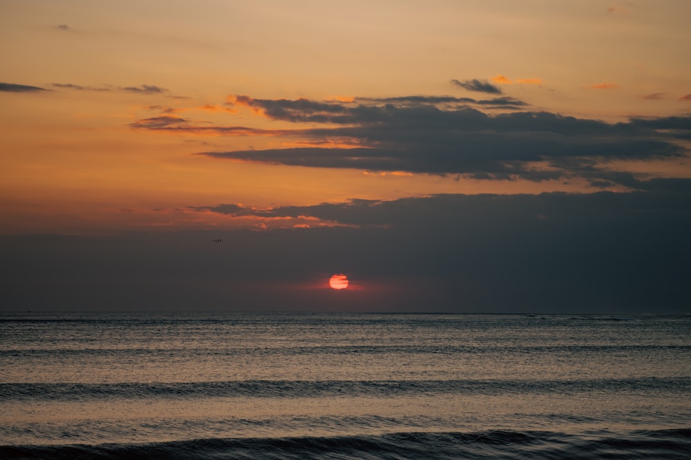 a sunset over a body of water