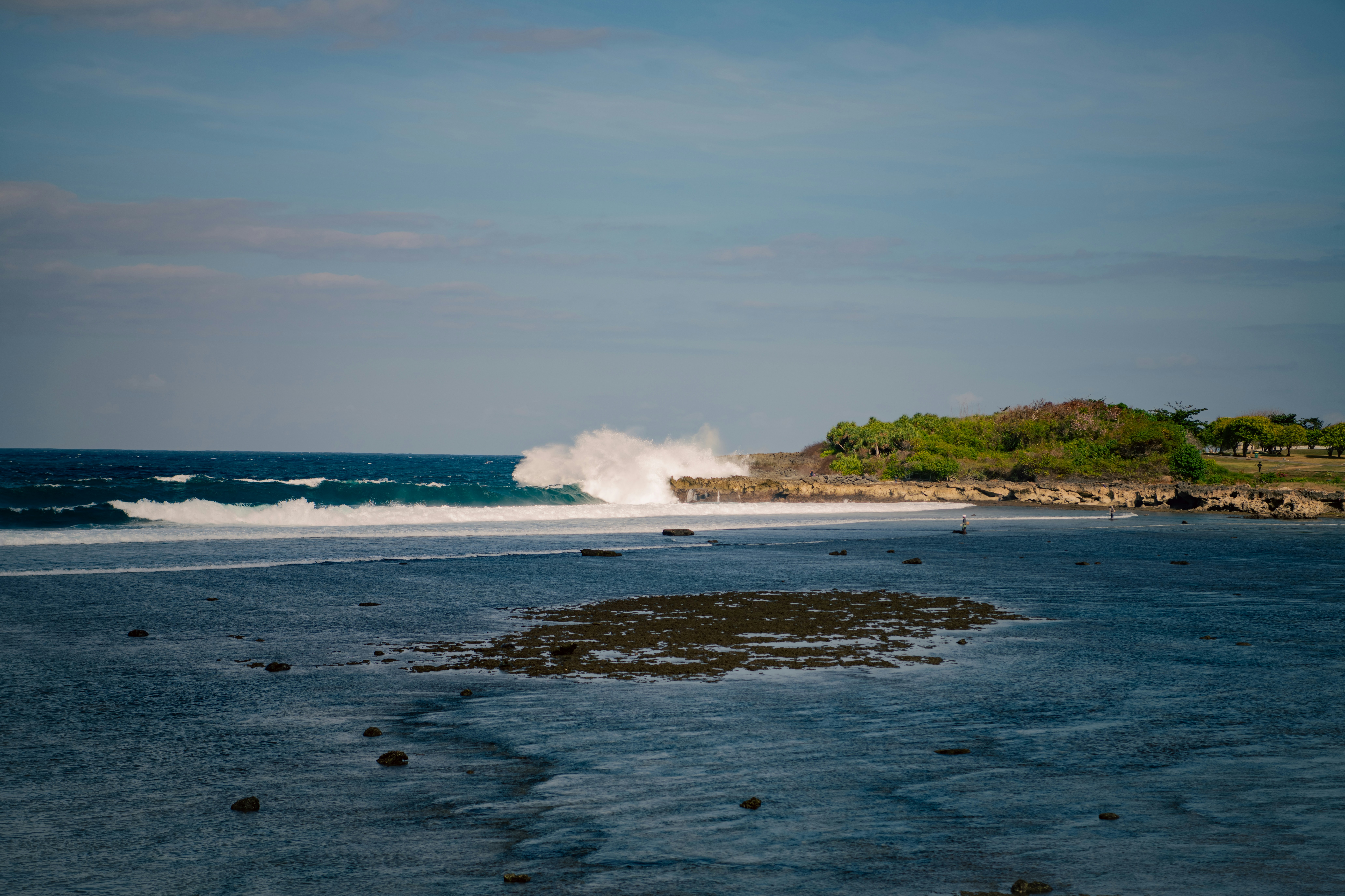 a beach with waves crashing
