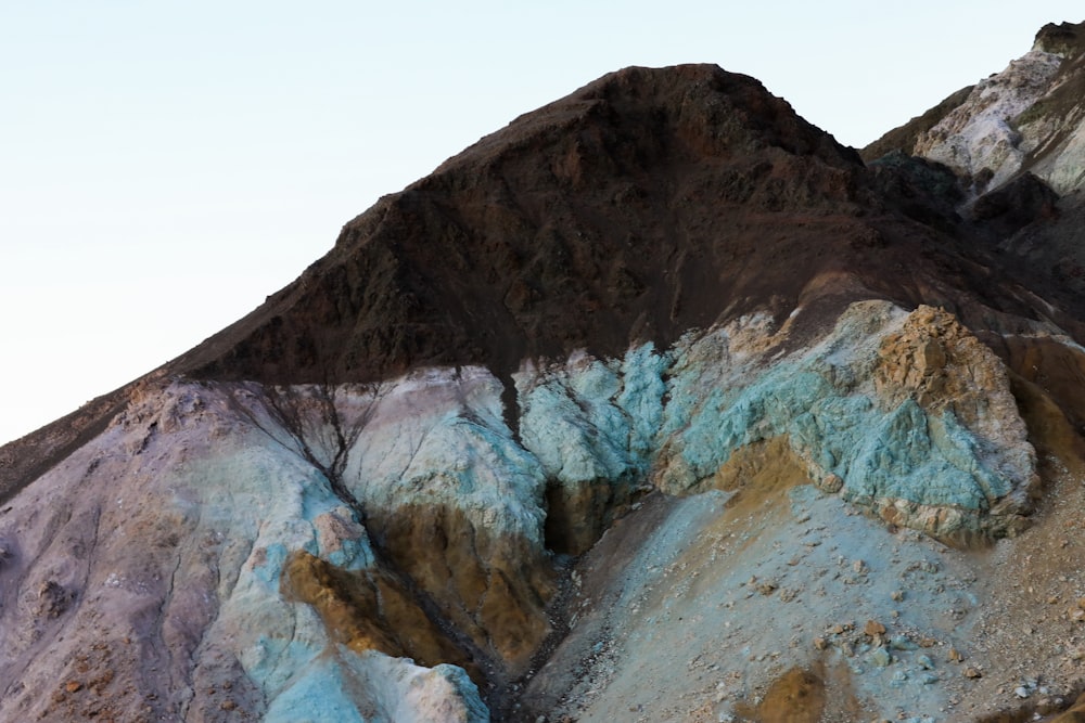 a rocky mountain with snow