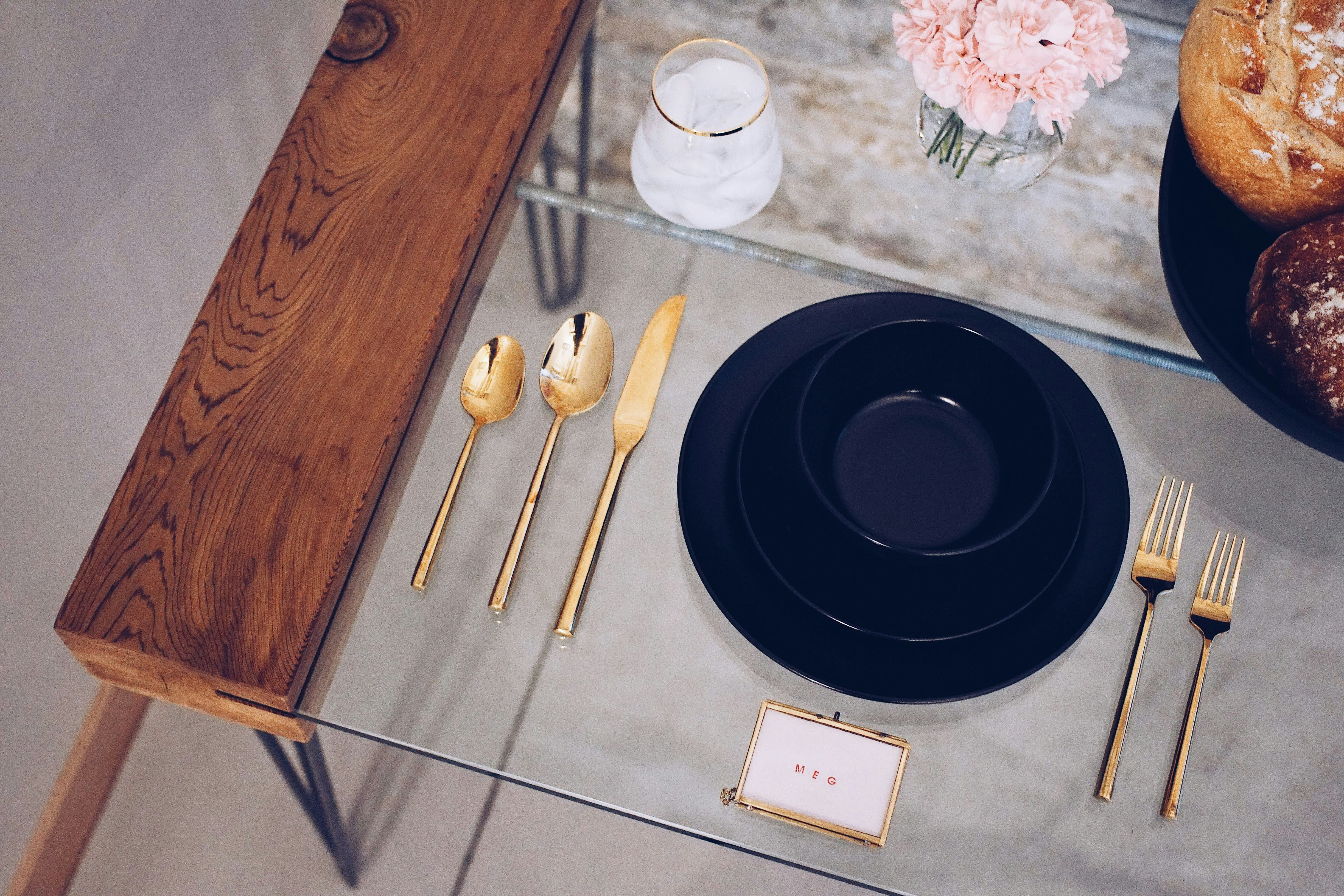 a plate and utensils on a table
