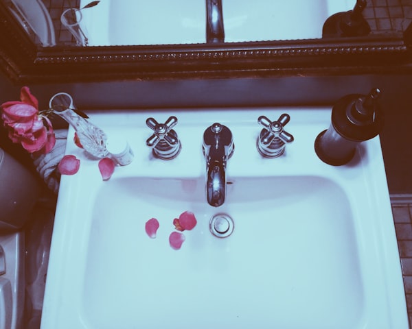 Messy bathroom with cleaning products