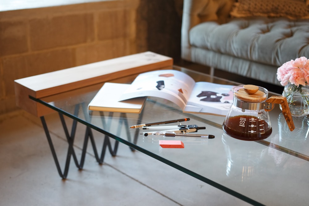 a table with a book and a pen on it