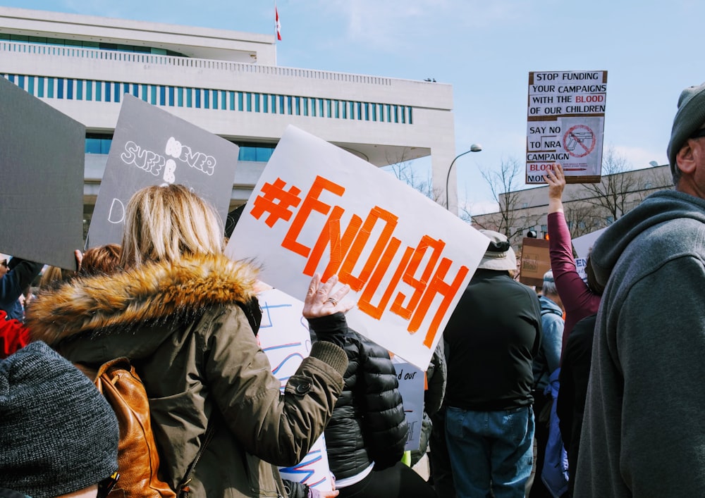 a group of people holding signs