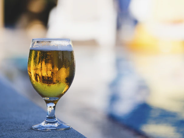a glass of yellow liquid