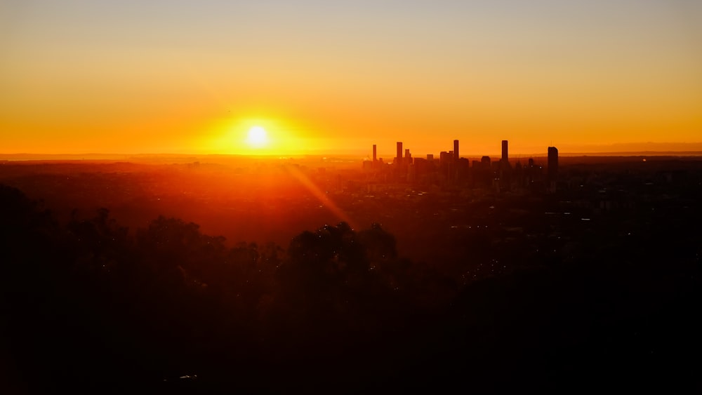 a sunset over a city