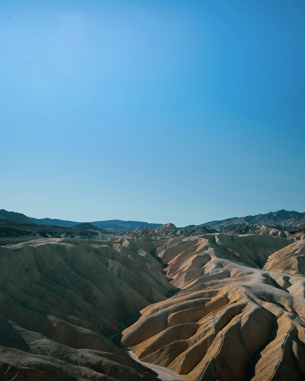 a rocky landscape with a blue sky