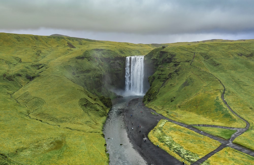 a waterfall in a valley