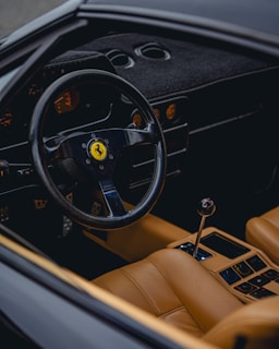the steering wheel and dashboard of a car