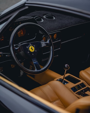 the steering wheel and dashboard of a car