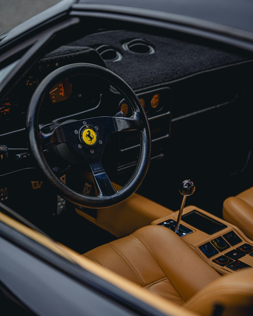 the steering wheel and dashboard of a car