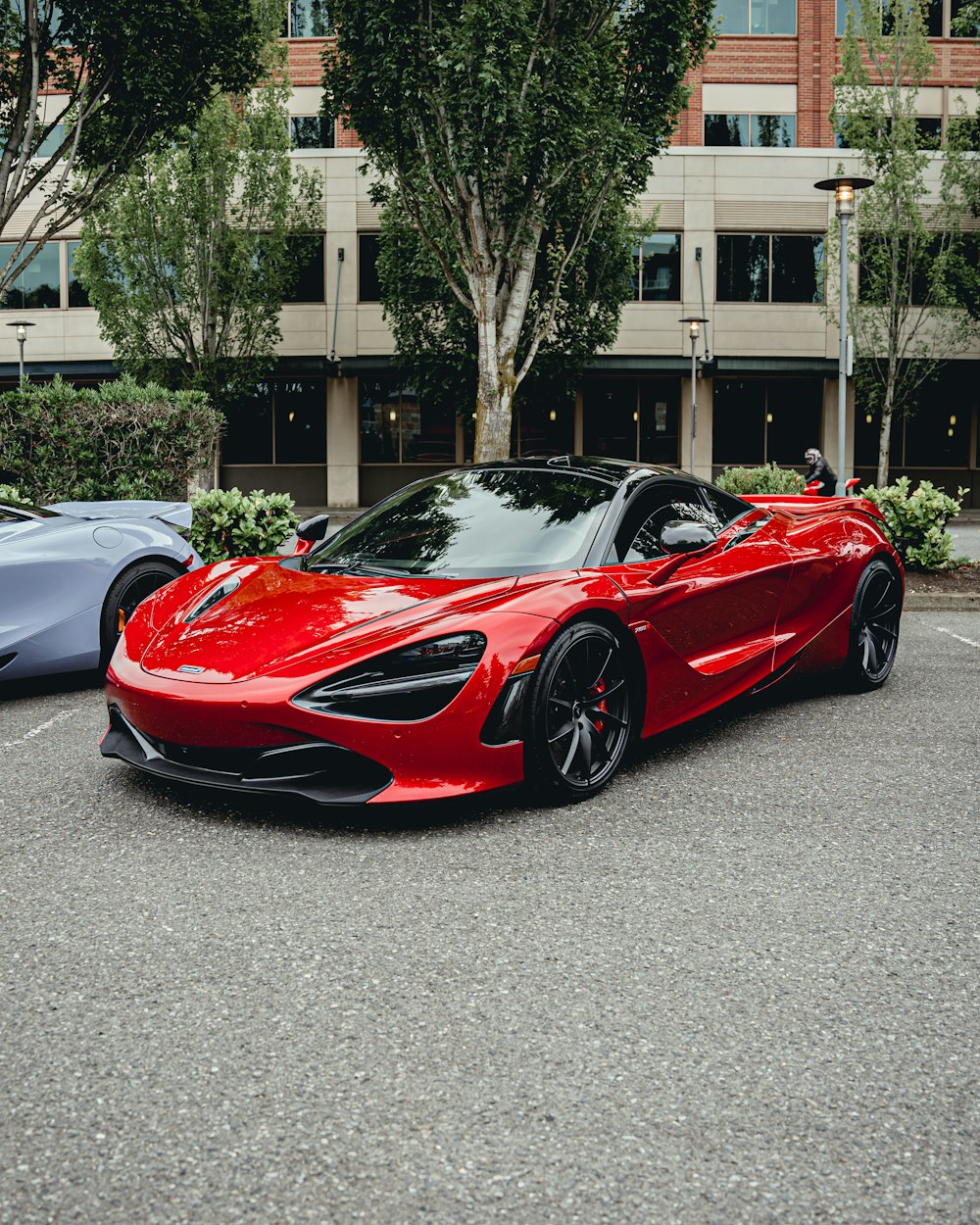 a red sports car parked on the side of a road