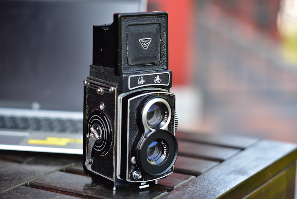 a black camera on a table