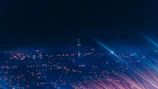 Wide shot of Karachi’s night skyline with subtle film reel animation overlay and moody shadows.