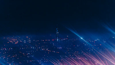 Wide shot of Karachi’s night skyline with subtle film reel animation overlay and moody shadows.