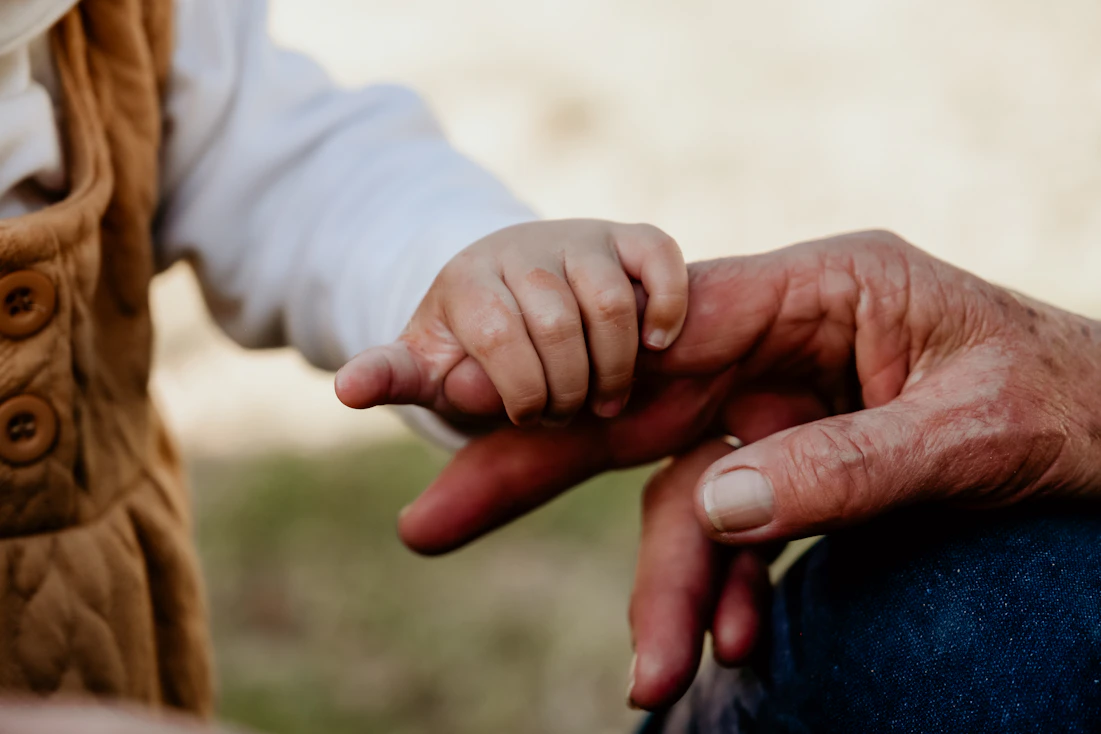 a close-up of hands shaking