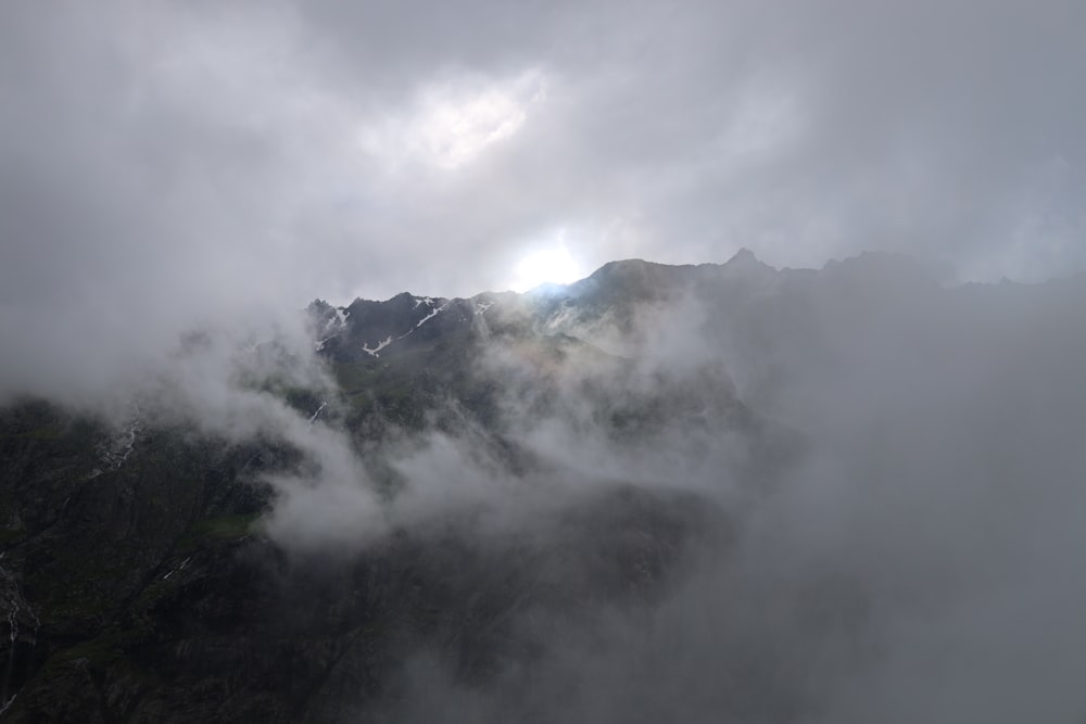 a mountain covered in clouds