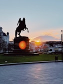 Sunset over the Guadalquivir River with silhouettes of horse races in Sanlúcar