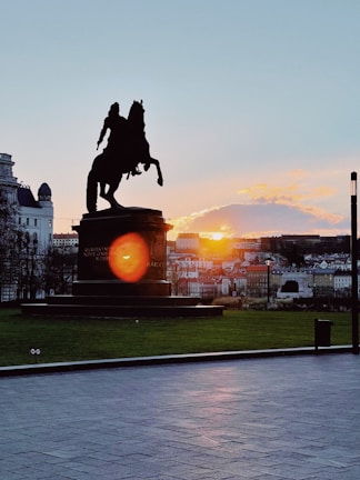 Sunset over the Guadalquivir River with silhouettes of horse races in Sanlúcar