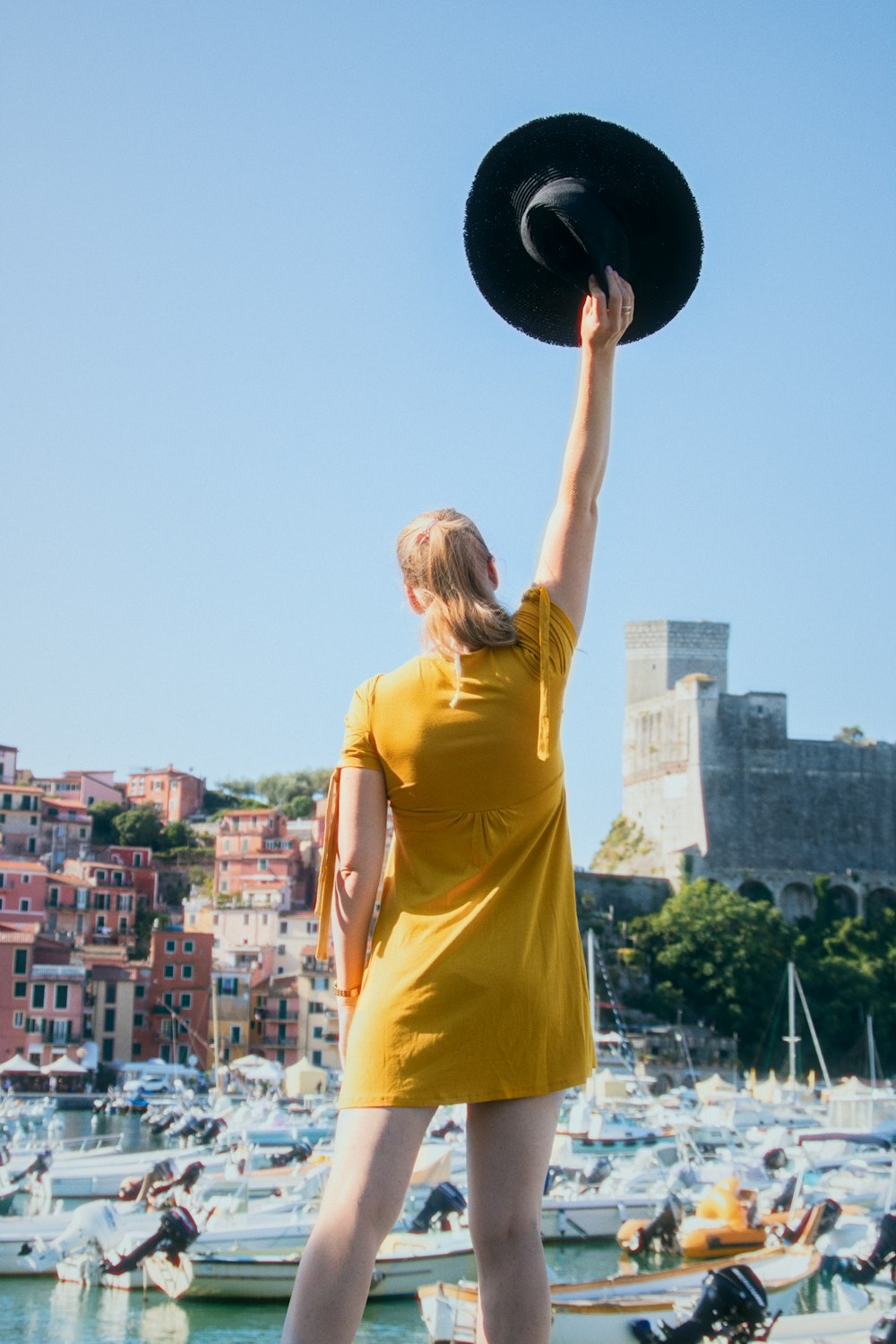 a person holding a black ball