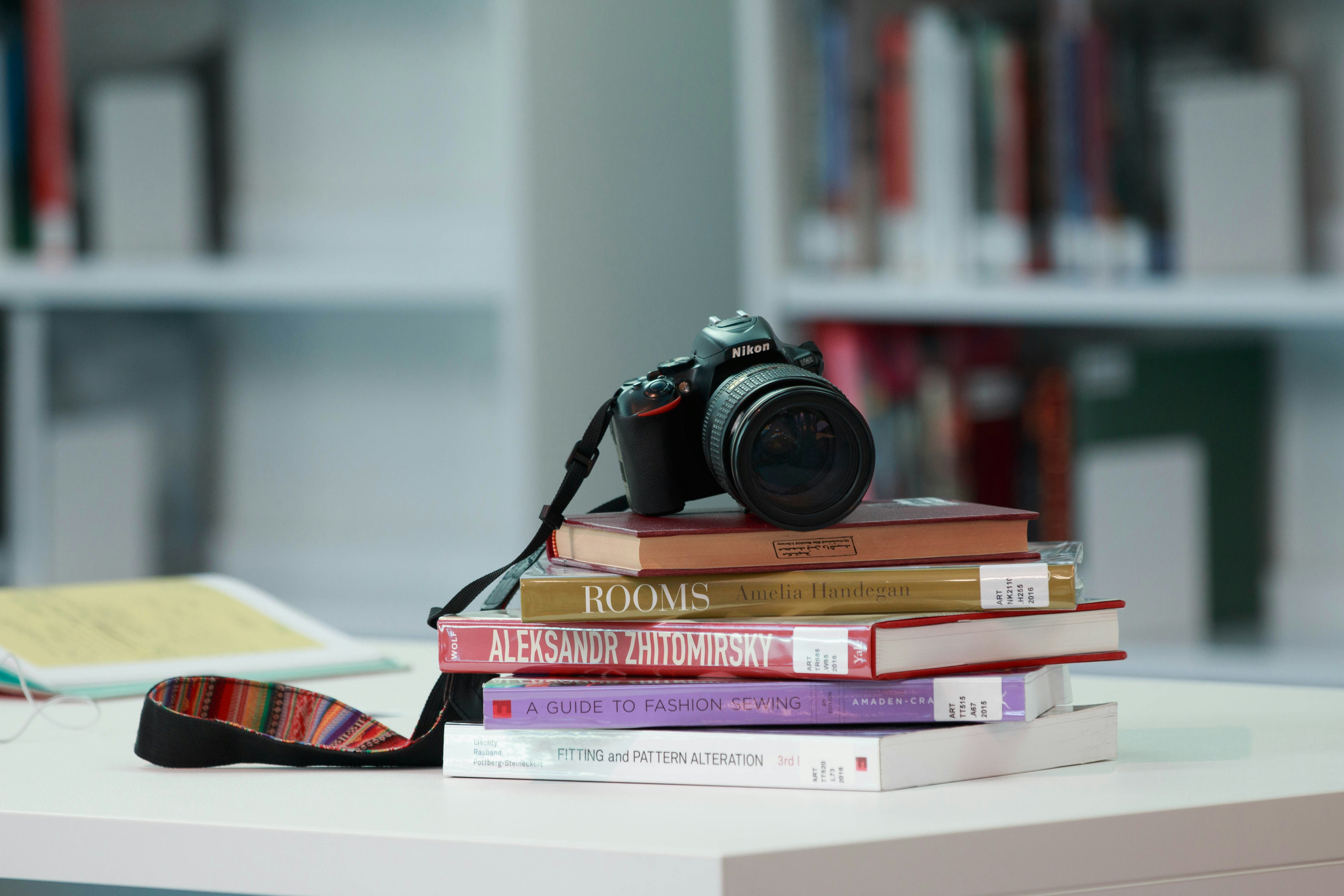 a camera on top of a stack of books