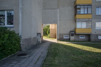 a building with a grass yard