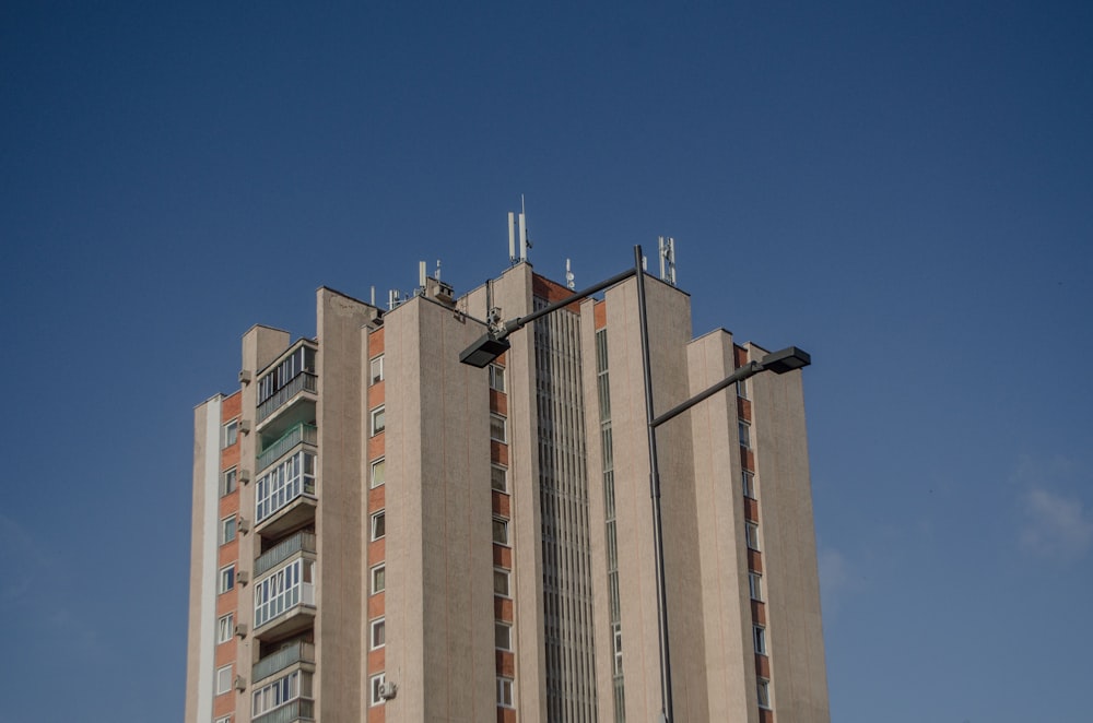 a tall building with a blue sky