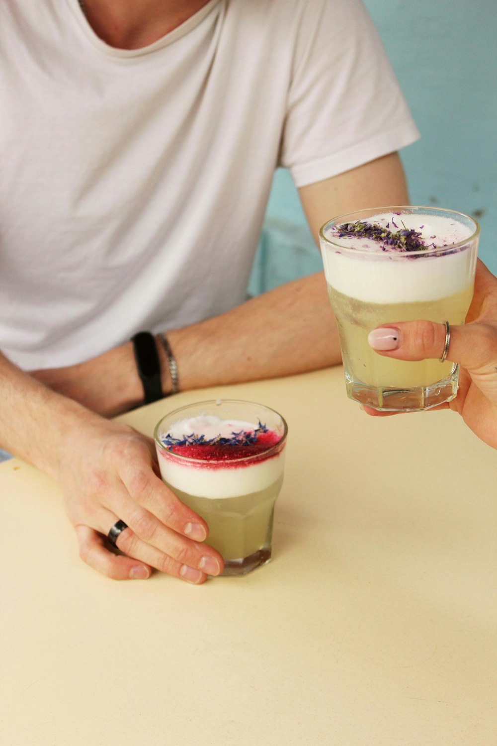 a man and a woman holding drinks