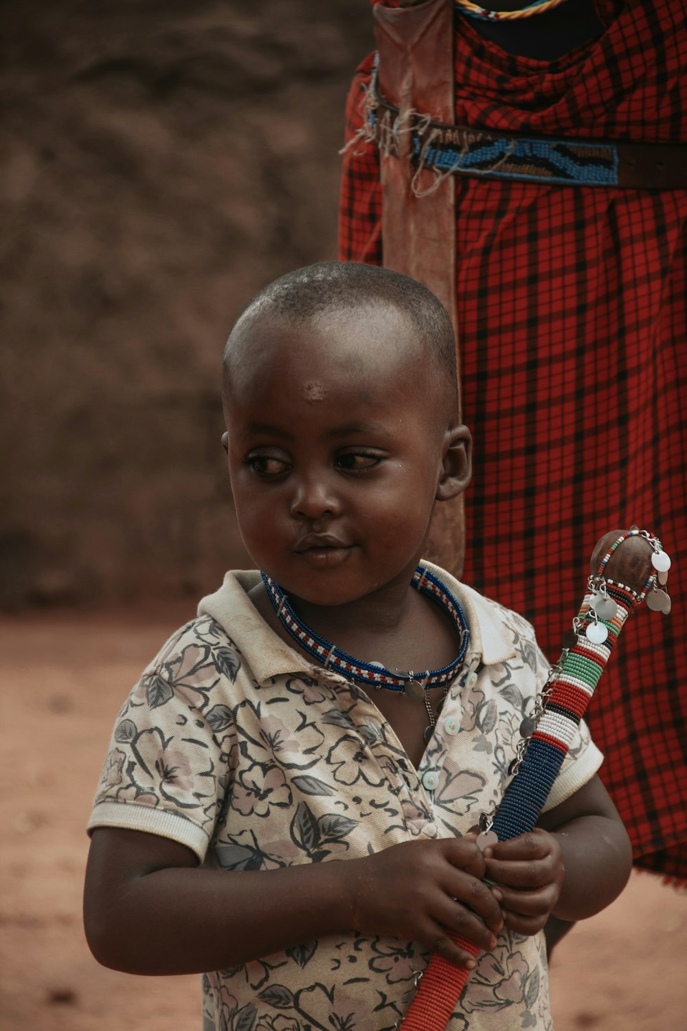 a young boy holding a bottle