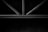 Metal rods form a geometric pattern, likely part of a structure or furniture piece, set against a dark background.