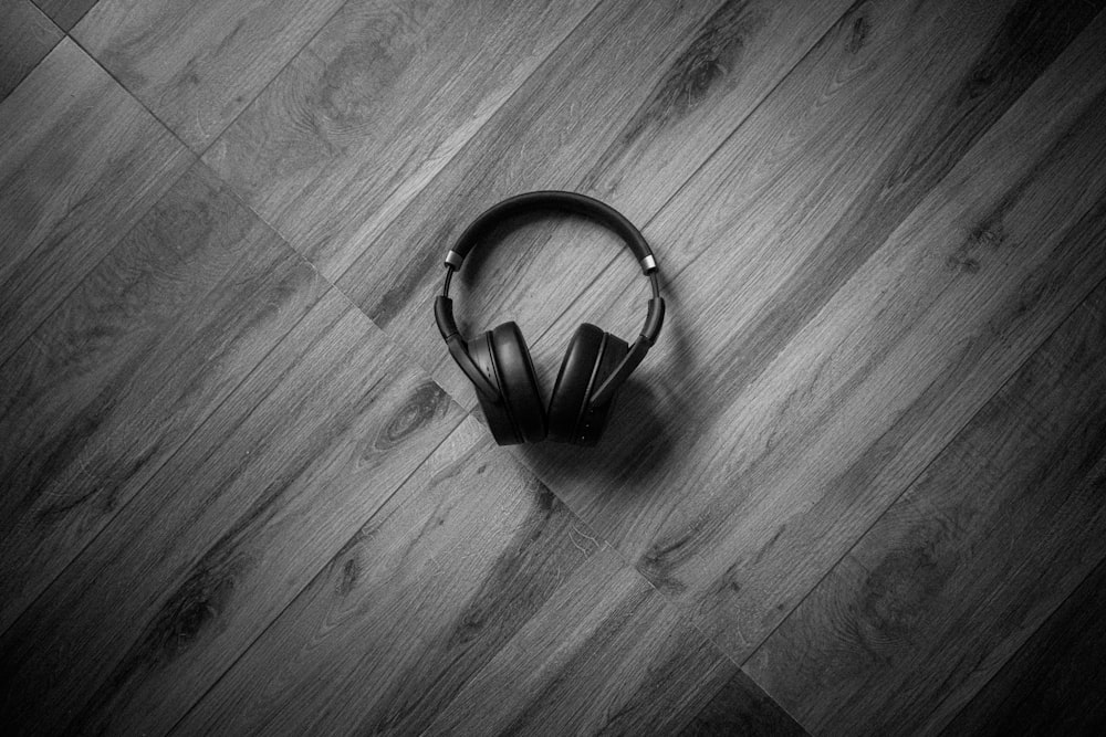 a black and white photo of a black and white purse on a wooden surface